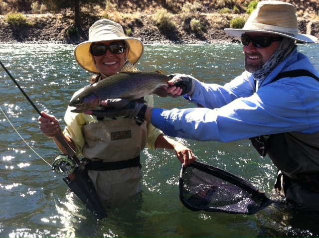 A client with a nice big trout on the Deschutes!
